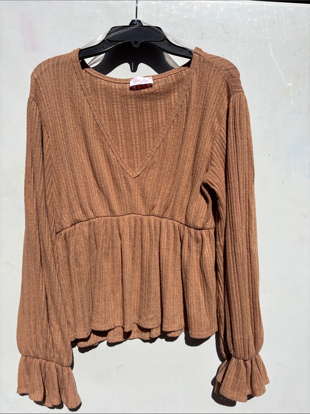 Pink Lily Ribbed V-Neck Peplum Long-Sleeve Top in Brown medium
